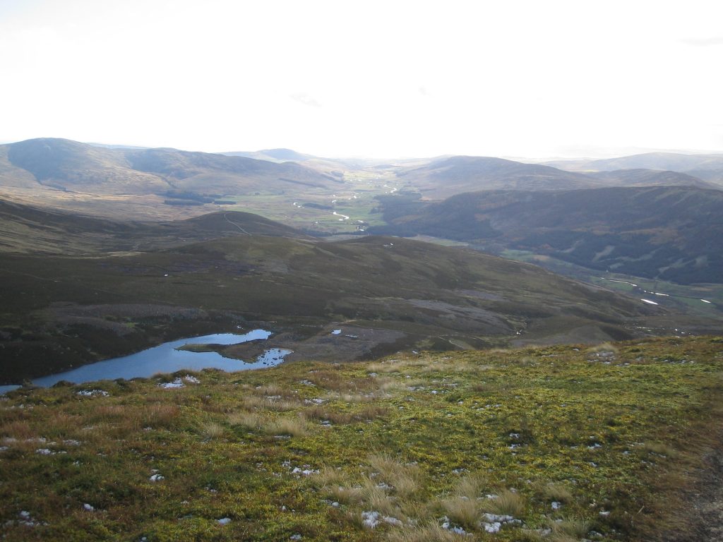 Scottish Highlands landscape with hills and loch