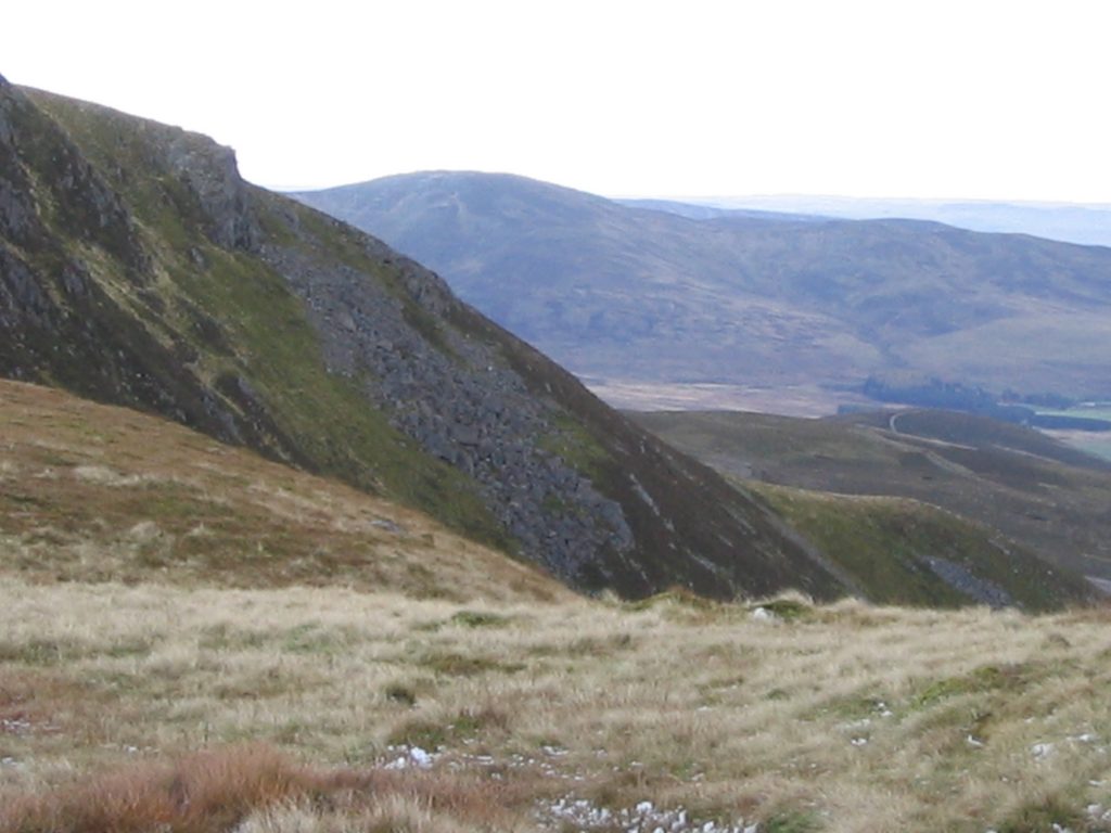 Scenic mountain landscape with grassy hillsides.