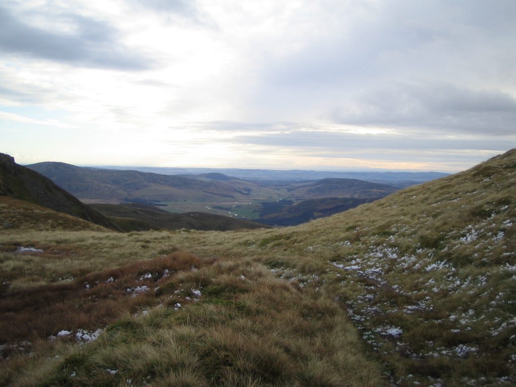 Scottish Highlands landscape with grass and hills