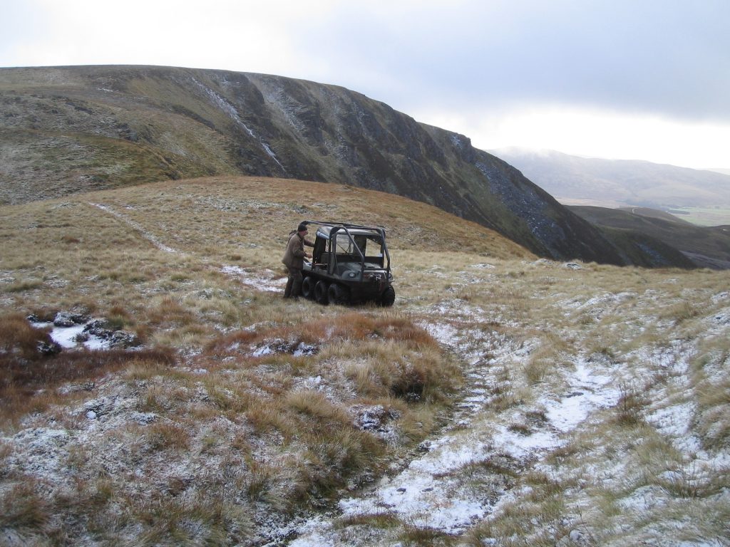 All-terrain vehicle on snowy moorland terrain